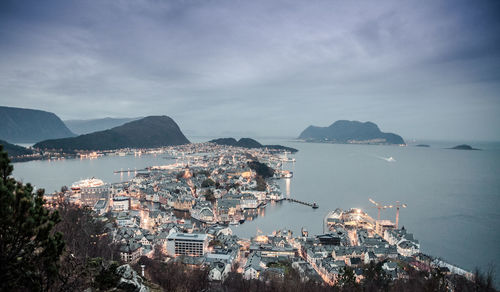 High angle view of built structures against calm sea