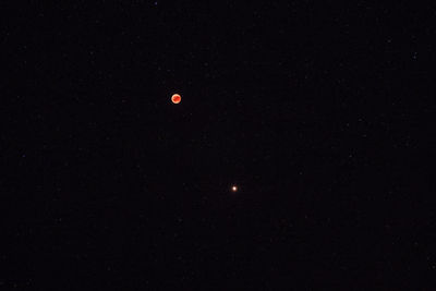 Low angle view of moon against sky at night