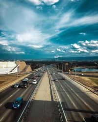 Highway in city against sky