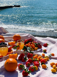 Fruits on table at beach