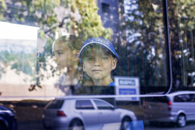Portrait of young woman standing on street