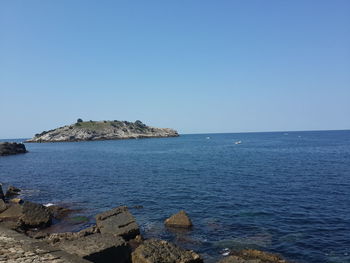 Scenic view of sea against clear sky