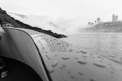 Close-up of car moving on sea