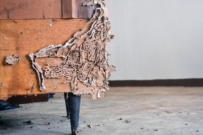 Close-up of weathered sofa at home