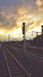 Railroad track against cloudy sky