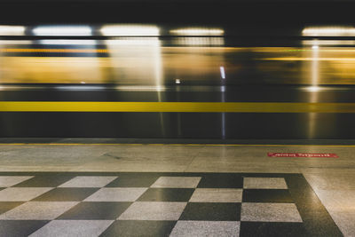 Blurred motion of illuminated subway station