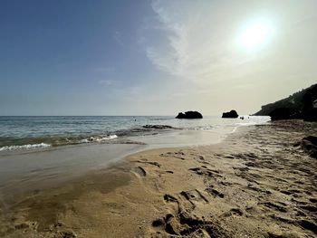 Scenic view of beach against sky