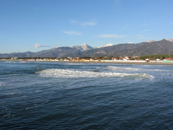 Scenic view of sea against blue sky