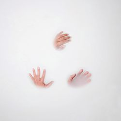 Cropped hands of people in milkbath