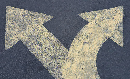 Shadow of person on road