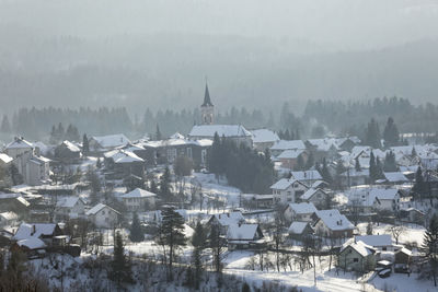 High angle view of buildings in city during winter