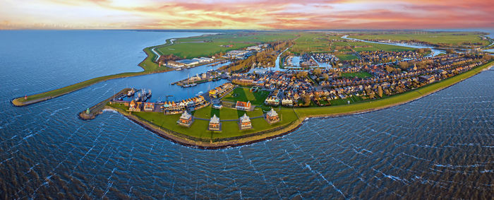 Aerial panorama from the historical town stavoren at the ijsselmeer in the netherlands at sunset
