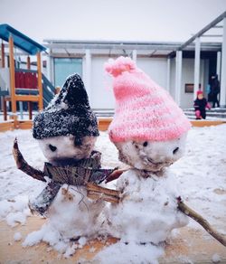 Close-up of toys in snow