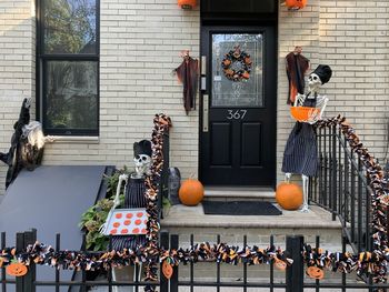 Halloween decorations on street against buildings in city