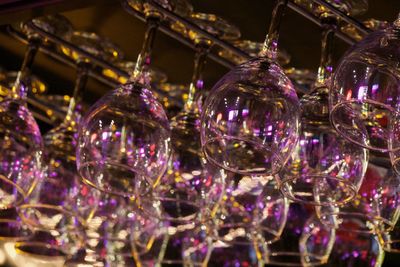Close-up of glass decorations hanging at market stall