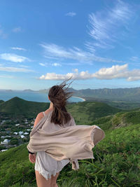 Rear view of woman looking at mountains