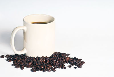 Close-up of coffee cup against white background