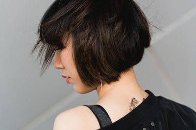 Rear view of woman with short hair
