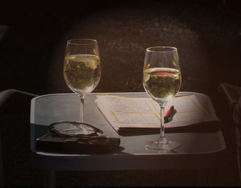 Close-up of wine glasses on table