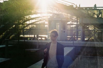 Portrait of girl and the bridge structure in the background