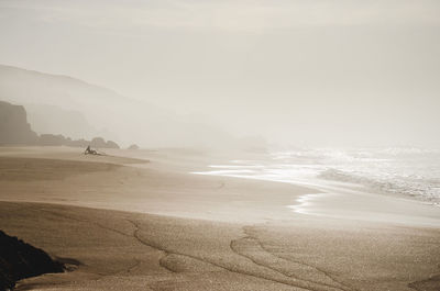 Scenic view of beach against sky