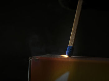 Close-up of drinking glass against black background