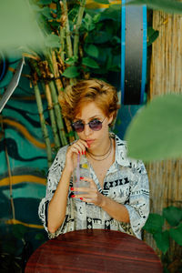 Portrait of woman sitting outdoors