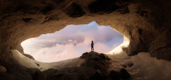 Man standing in cave