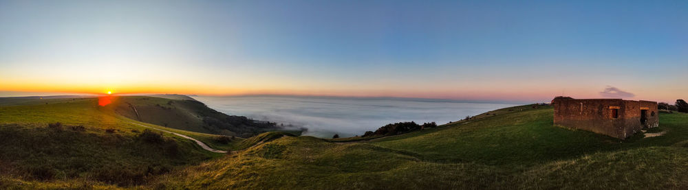 Scenic view of landscape against sky during sunset
