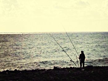 Man fishing in sea