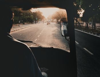 Road in city seen through car windshield