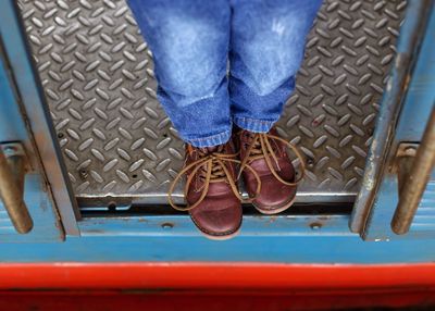 Low section of boy in train