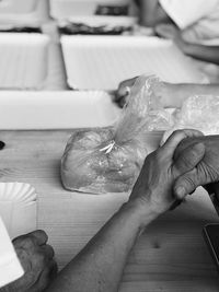 High angle view of person preparing food on table