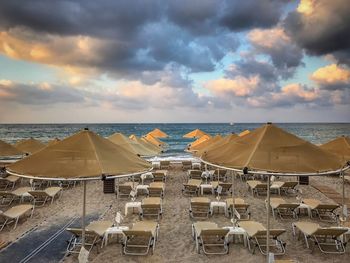 Panoramic view of beach against sky during sunset