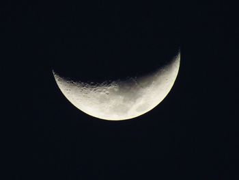 Low angle view of moon against sky at night