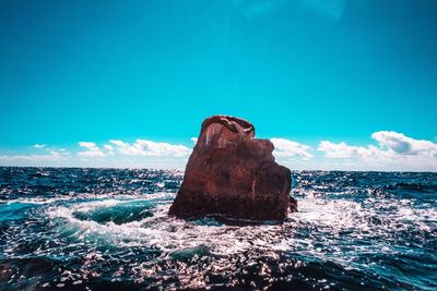 Scenic view of sea against blue sky