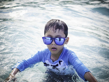 Portrait of boy in swimming pool