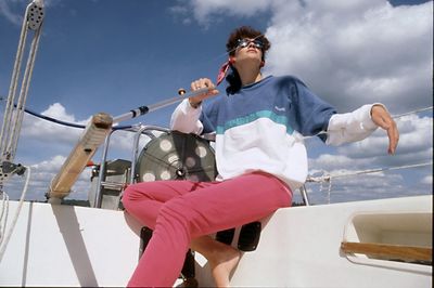 Woman on boat against sky