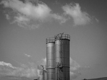 Low angle view of smoke stack against sky