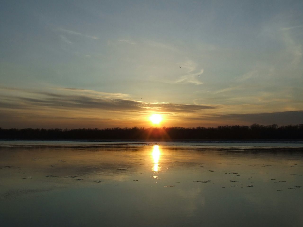 sunset, reflection, water, tranquil scene, sun, tranquility, scenics, beauty in nature, lake, sky, nature, idyllic, sunlight, silhouette, cloud - sky, orange color, non-urban scene, outdoors, waterfront, beach