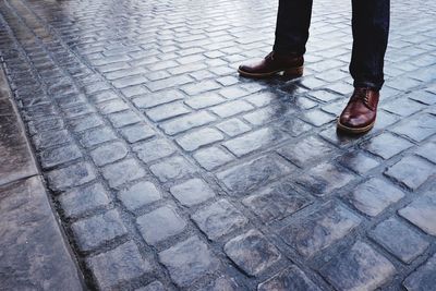 Low section of people standing on footpath