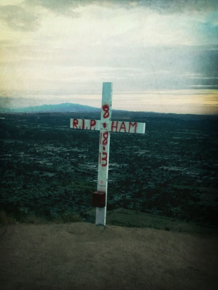 guidance, sky, text, communication, direction, western script, cloud - sky, tranquility, information sign, safety, built structure, landscape, tranquil scene, nature, sign, field, protection, security, day, no people