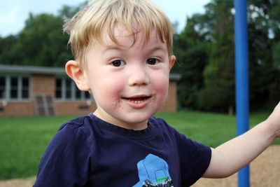 Close-up portrait of smiling cute boy