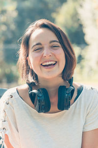 Portrait of young woman standing outdoors
