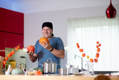 Man holding food on table at home