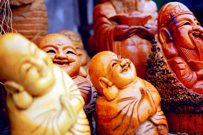 Close-up of wooden sculptures at store