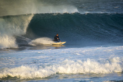 Man surfing in sea