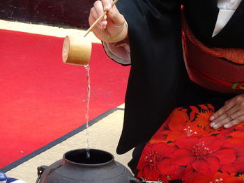 High angle view of woman holding drink