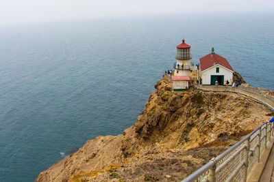 High angle view of building by sea against sky
