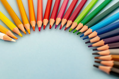 Close-up of multi colored pencils on table